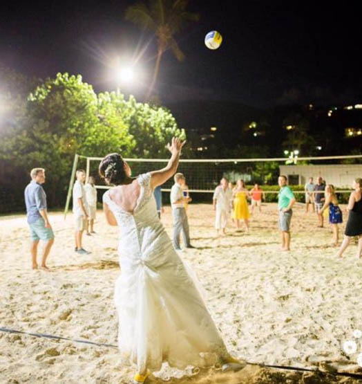 Wedding Party playing sand volleyball at Bolongo Bay.