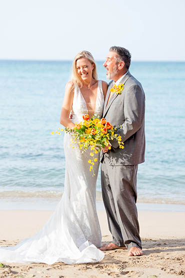 Marriage vow renewals barefoot on St Thomas USVI beach.