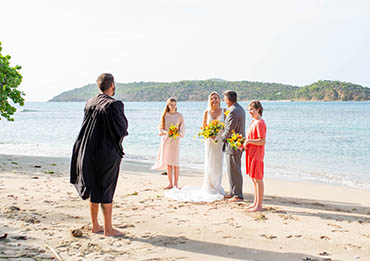 Vow renewal ceremony with kids on a tropical beach in St. Thomas US Virgin Islands.