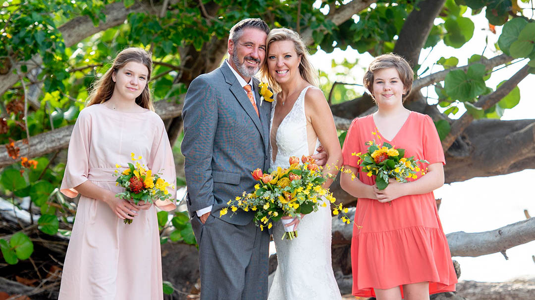 Family together on a beautiful beach for vow renewal ceremony in USVI.