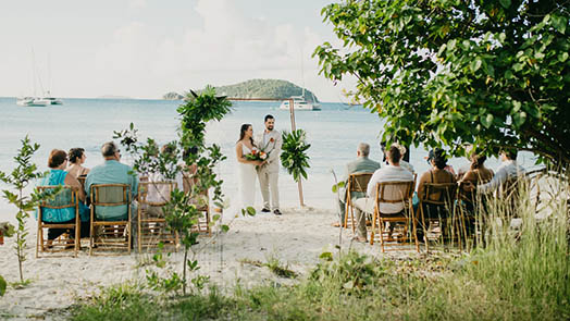 Wedding couple in front of colorful mural in St. Thomas US Virgin Islands.