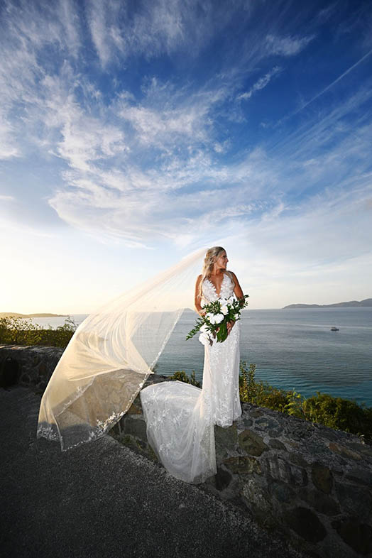 Wedding couple in front of colorful mural in St. Thomas US Virgin Islands.