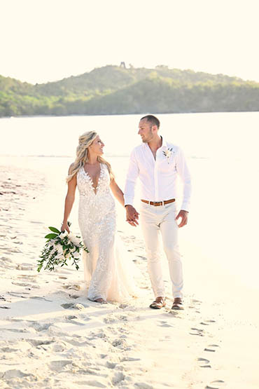 Happily wedded couple renewing their vows on a beach in St Thomas.