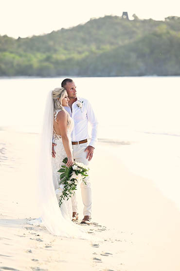 Happily wedded couple renewing their vows on a beach in St Thomas.