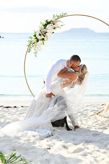 Happily wedded couple renewing their vows on a beach in St Thomas.