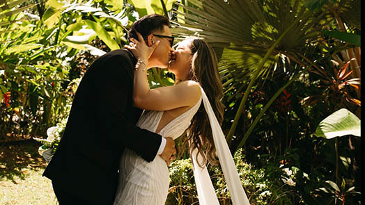 Wedding couple in front of colorful mural in St. Thomas US Virgin Islands.