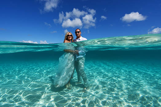 Wedding couple in front of colorful mural in St. Thomas US Virgin Islands.