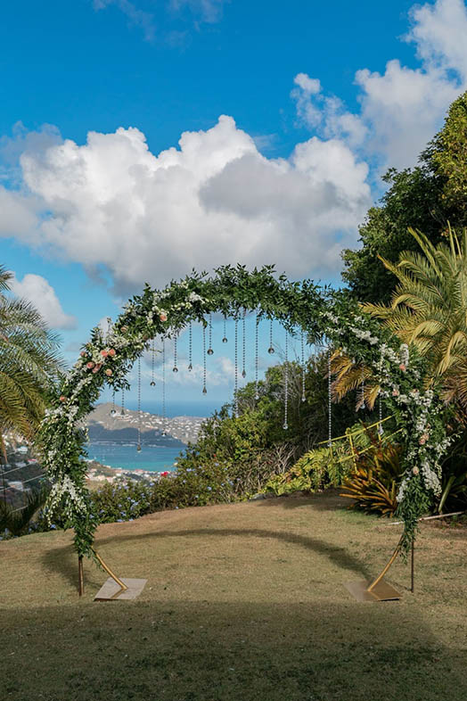 Wedding couple in front of colorful mural in St. Thomas US Virgin Islands.