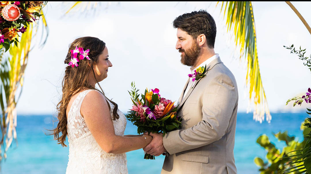 Family together on a beautiful beach for vow renewal ceremony in USVI.